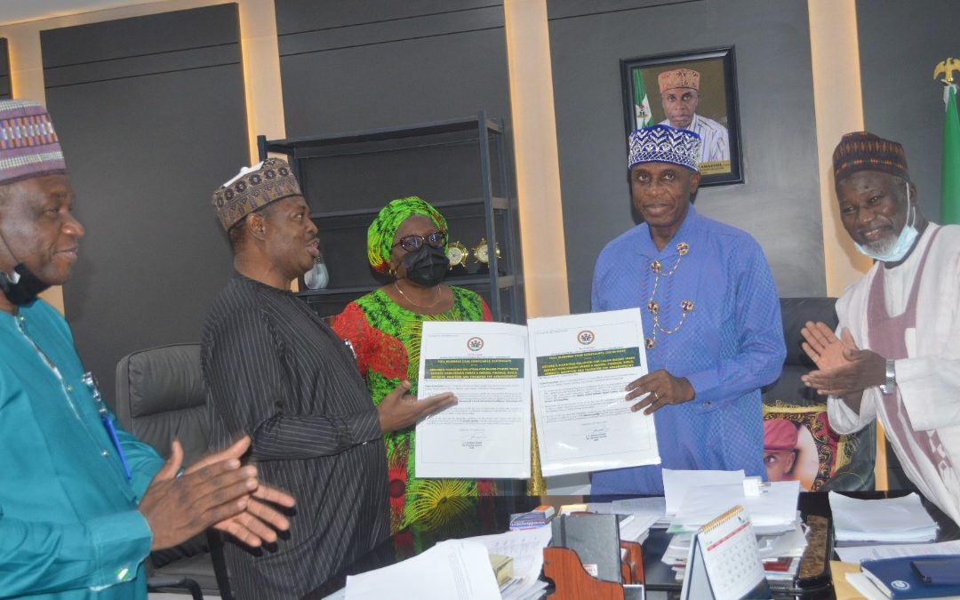 Acting DG of ICRC Michael Ohiani, Presenting the Full Business Case Certificates to the Minister of Transportation Rotimi Amaechi