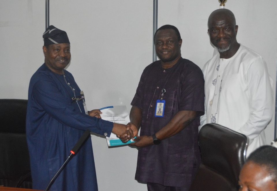 Ag. Director General of ICRC, Michael Ohiani presenting certificates at the end of a Risk Management training for select Ministries, Departments and Agencies (MDAs)